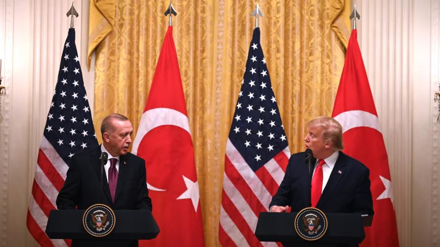 US President Donald Trump and Turkey's President Recep Tayyip Erdogan (L) take part in a joint press conference in the East Room of the White House in Washington, DC on November 13, 2019. - President Donald Trump greeted his Turkish counterpart Recep Tayyip Erdogan at the White House for a high-stakes meeting Wednesday that underlined his claim to be ignoring the impeachment drama unfolding simultaneously in Congress. (Photo by JIM WATSON / AFP) (Photo by JIM WATSON/AFP via Getty Images)