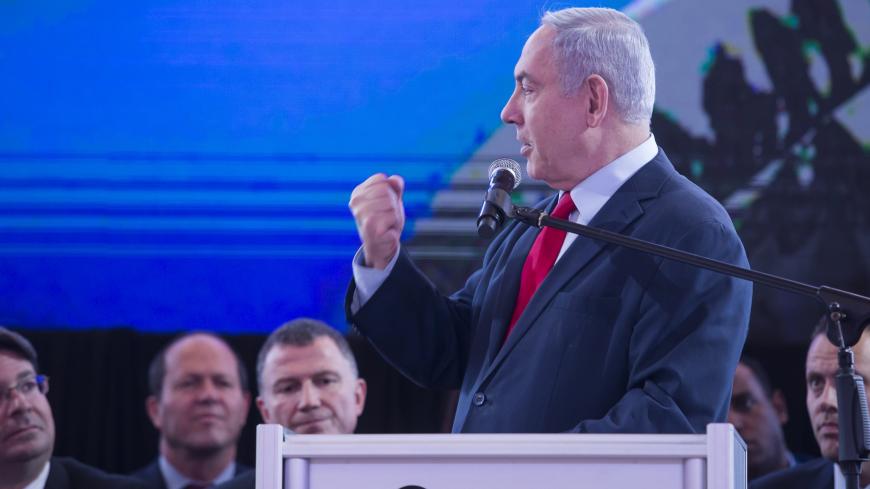 Benny Gantz (C), A former IDF Chief and the head of Israeli Resilience party speaks to supporters during an election campaign event in Tel Aviv. Israelis will vote in a parliamentary election on April 9, choosing among party lists of candidates to serve in the 121-seat Knesset