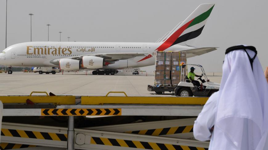 Tonnes of medical equipment and coronavirus testing kits provided bt the World Health Organisation are pictured passing by an Emirates airlines Airbus A380-861, at the al-Maktum International airport in Dubai on March 2, 2020 as it is prepared to be delivered to Iran with a United Arab Emirates military transport plane. (Photo by KARIM SAHIB / AFP) (Photo by KARIM SAHIB/AFP via Getty Images)