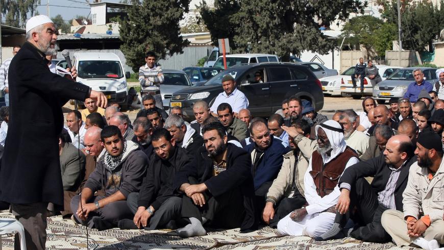 Arab Israeli Sheikh Raed Salah delivers a sermon during a prayer outside a mosque in the Israeli city of Lod, 30 kms west of Tel Aviv, as a protest against house demolitions in the city on January 29, 2010. Hundreds of people protested against the demolition of Arab-Israeli homes in Lod. Jamal Zahalka, an Arab MP among the protesters said a total of 40,000 Arab homes in Israel were threatened with demolition. AFP PHOTO/JACK GUEZ (Photo credit should read JACK GUEZ/AFP via Getty Images)