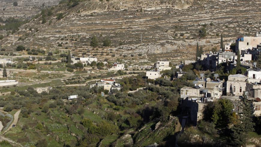 Terraced agricultural fields are seen in Battir village, south of Jerusalem, December 12, 2012. An Israeli government environmental agency challenged the Defence Ministry in court on Wednesday over a section of the controversial West Bank wall that threatens Battir, an ancient Palestinian farming community. Gilo, an urban complex built in a part of the occupied West Bank that Israel captured in a 1967 Middle East war and later annexed to Jerusalem, is seen in the back. REUTERS/Ammar Awad (WEST BANK - Tags: 