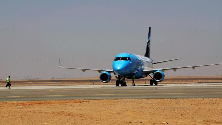 An EgyptAir plane lands on the runway of the Capital International Airport, a new airport built for Egypt's new capital, known as the New Administrative Capital (NAC), east of Cairo, Egypt July 9, 2019. Picture taken July 9, 2019. REUTERS/Hayam Adel - RC15C51DE710