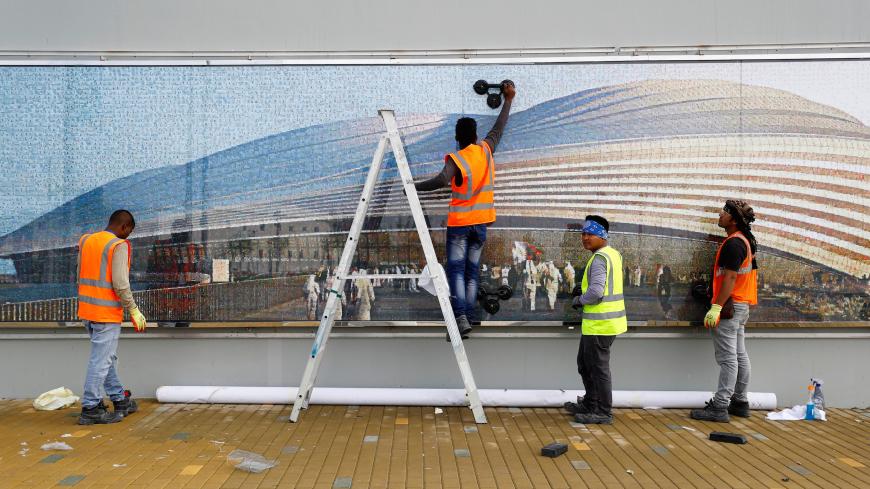Workers are seen at the Al Janoub Stadium built for the upcoming 2022 FIFA World Cup soccer championship during a stadium tour in Al Wakrah, Qatar, December 16, 2019.  REUTERS/Corinna Kern - RC2EWD9VPND9