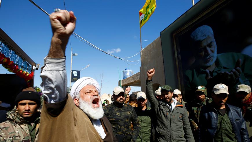An Iranian cleric chants slogans as they gather to mourn during the forty days memorial, after the killing of Iran's Quds Force top commander Qassem Soleimani and the Iraqi militia commander Abu Mahdi al-Muhandis in a U.S. air strike at Baghdad airport, at the "Valley of Peace" cemetery in Najaf, Iraq February 11, 2020. REUTERS/Alaa al-Marjani - RC2BYE9HRC06