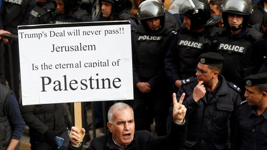 A man shouts slogans during a protest against U.S. President Donald Trump's proposed Middle East peace plan, and a government's agreement to import natural gas from Israel, in Amman, Jordan, February 14, 2020. REUTERS/Muhammad Hamed - RC2D0F9CTTZQ