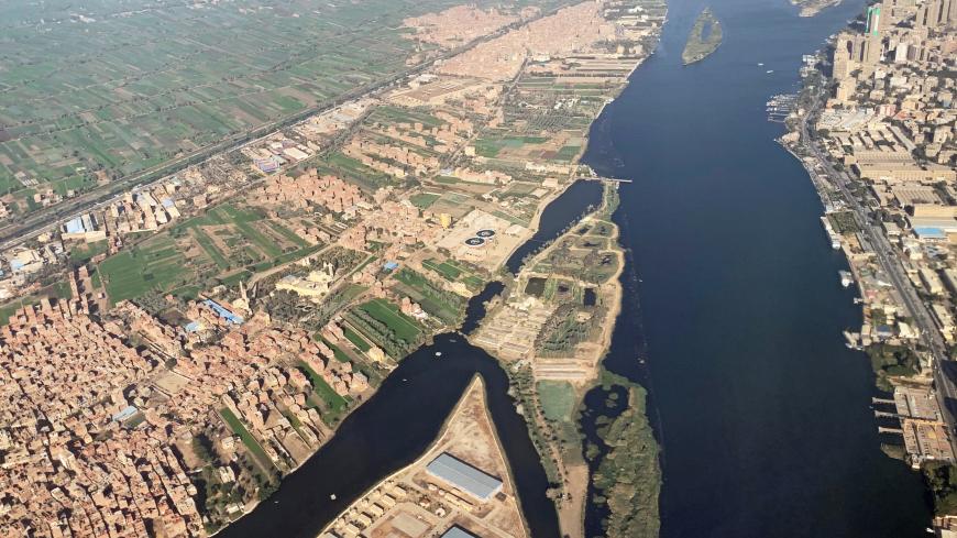 A view from an airplane window shows buildings around the Nile River in Cairo, Egypt March 10, 2020. REUTERS/Mohamed Abd El Ghany - RC25HF9RMT2R