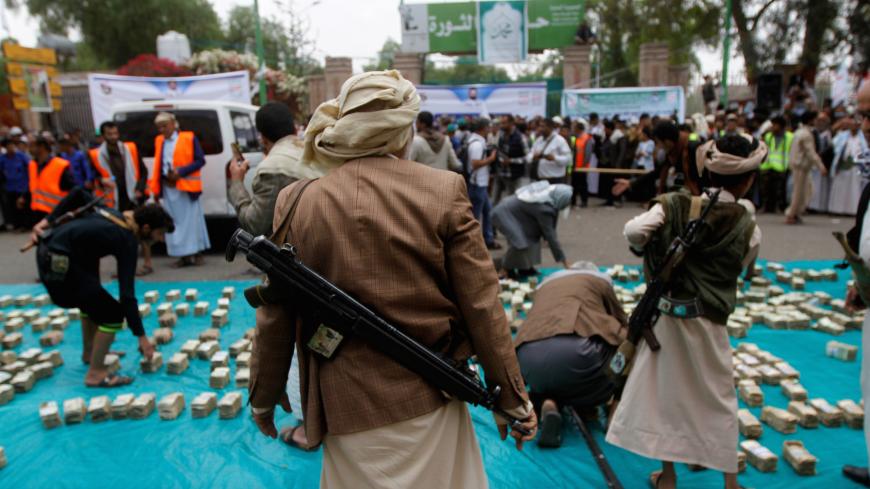 Houthi supporters carry weapons during a gathering in Sanaa, Yemen April 2, 2020. REUTERS/Mohamed al-Sayaghi - RC2CWF9474G8