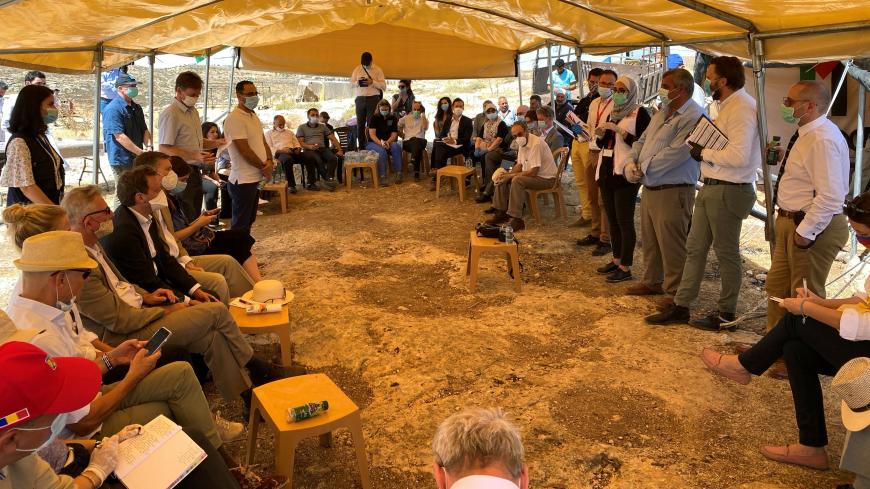 NGO workers speak to European Union heads of mission and other local envoys about the impact of Israeli annexation, during a diplomatic tour of Palestinian villages, near al-Mughayyir in the Israeli-occupied West Bank June 11, 2020. REUTERS/Rami Ayyub - RC2Y6H9D0HGZ