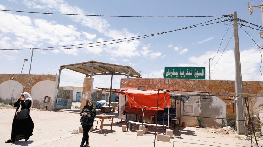 Women walk near "Souk Libya" marketplace in the town of Ben Guerdane, near the Libyan border in Tunisia May 24, 2019. Picture taken May 24, 2019. REUTERS/Zoubeir Souissi - RC1A9F83BA60