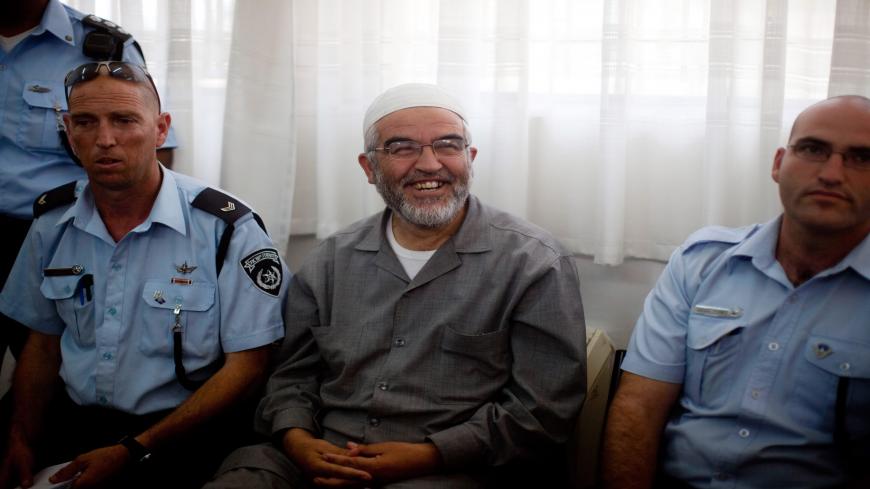 ASHKELON, ISRAEL - JUNE 01:  (ISRAEL OUT) Sheikh Raed Salah, the head of the Northern Branch of the Islamic Movement in Israel, sits in Magistrates Court after he was arrested on the Gaza flotilla on June 1, 2010 in Ashkelon, Israel.  Salah was interviewed by Israeli police on his role in the Gaza aid flotilla after participating in the flotilla which clashed with Israeli forces. Other members of the Arab sector are also being held in police custody.  (Photo by Uriel Sinai/Getty Images)