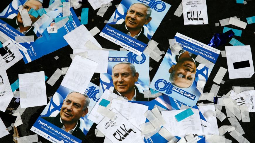 TOPSHOT - This picture taken early on April 10, 2019 shows Israeli Likud Party campaign material and posters of Prime Minister Benjamin Netanyahu strown on the floor following election night at the party headquarters in the coastal city of Tel Aviv. (Photo by Jack GUEZ / AFP) (Photo credit should read JACK GUEZ/AFP via Getty Images)