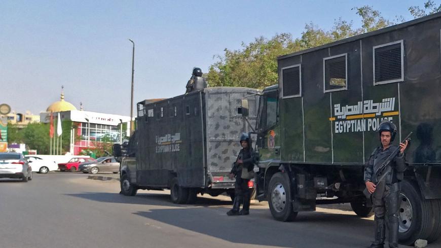 Egyptian riot police stand guard in Egypt's capital Cairo on September 27, 2019. - Egypt's President dismissed today a call for a second weekend of protests as "no reason for concern", with hundreds already arrested in an intensifying crackdown on a rare show of discontent on the streets. (Photo by Khaled DESOUKI / AFP)        (Photo credit should read KHALED DESOUKI/AFP via Getty Images)
