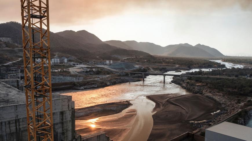 A general view of the Blue Nile river as it passes through the Grand Ethiopian Renaissance Dam (GERD),  near Guba in Ethiopia, on December 26, 2019. - The Grand Ethiopian Renaissance Dam, a 145-metre-high, 1.8-kilometre-long concrete colossus is set to become the largest hydropower plant in Africa.
Across Ethiopia, poor farmers and rich businessmen alike eagerly await the more than 6,000 megawatts of electricity officials say it will ultimately provide. 
Yet as thousands of workers toil day and night to fin
