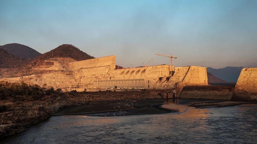 A general view of the the Grand Ethiopian Renaissance Dam (GERD), near Guba in Ethiopia, on December 26, 2019. - The Grand Ethiopian Renaissance Dam, a 145-metre-high, 1.8-kilometre-long concrete colossus is set to become the largest hydropower plant in Africa.
Across Ethiopia, poor farmers and rich businessmen alike eagerly await the more than 6,000 megawatts of electricity officials say it will ultimately provide. 
Yet as thousands of workers toil day and night to finish the project, Ethiopian negotiators
