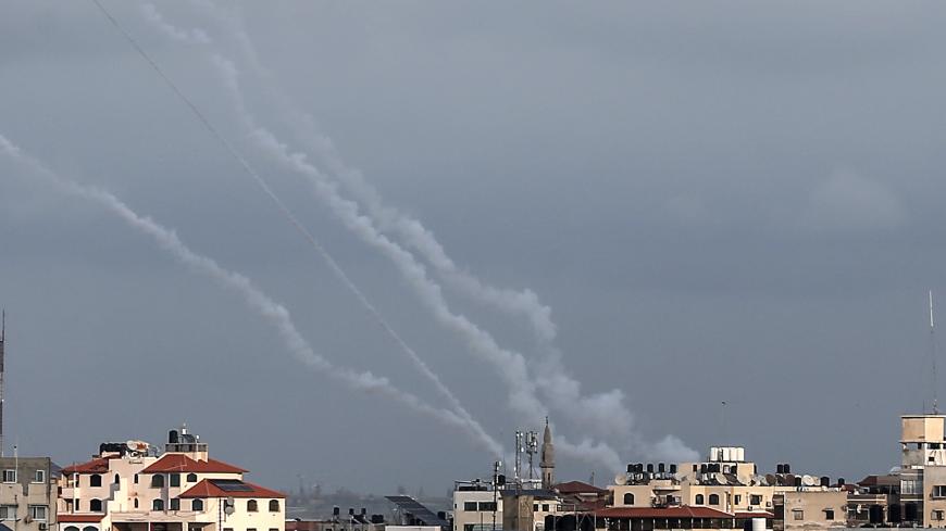 This picture taken on February 24, 2020, shows smoke trails from rockets fired by Palestinian militants in Gaza City. - Islamic Jihad militants claimed responsibility for another round of rockets fired towards Israel on February 24 following a new flare-up between the group and the Jewish state. Israel's army said six "projectiles" had been fired from Gaza, but that its air defence systems had "intercepted five of the launches." (Photo by MAHMUD HAMS / AFP) (Photo by MAHMUD HAMS/AFP via Getty Images)