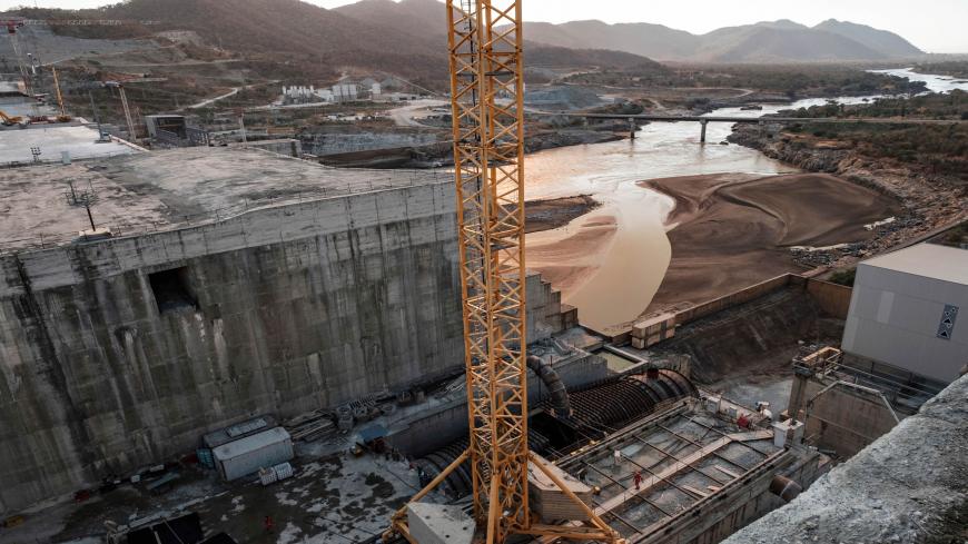 (FILES) This file photo taken on December 26, 2019 shows a general view of the Blue Nile river as it passes through the Grand Ethiopian Renaissance Dam (GERD), near Guba in Ethiopia. - The Nile, Egypt's lifeline since Pharaonic days, faces massive strain from pollution, over-use and climate change -- and now the threat of a colossal dam being built far upstream in Ethiopia. When its London-sized reservoir starts to fill this summer, Egypt fears the mega-project will spell an existential threat to its teemin