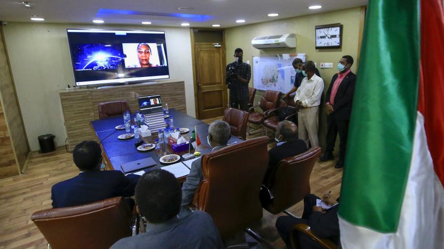 Sudan's Minister of Irrigation and Water Resources Yasir Mohamed takes part in a video meeting at the ministry in Khartoum on June 9, 2020, over the Grand Ethiopian Renaissance Dam. - Egypt's President Abdel Fattah al-Sisi strongly rebuked Ethiopia, accusing Addis Ababa of stalling negotiations over a mega-dam being built on the Nile and moving ahead with plans to start filling the reservoir before reaching a deal. The agreement signed between Egypt, Ethiopia and Sudan paved the way for diplomatic talks aft