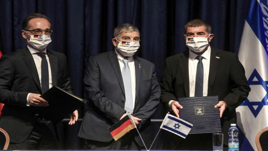 (L to R) Germany's Foreign Minister Heiko Maas, Chairman of the Yad Vashem Holocaust Remembrance Center Avner Shalev, and Israel's Foreign Minister Gabi Ashkenazi pose for a picture together after signing an agreement at the ministry headquarters in Jerusalem on June 10, 2020. (Photo by MENAHEM KAHANA / AFP) (Photo by MENAHEM KAHANA/AFP via Getty Images)
