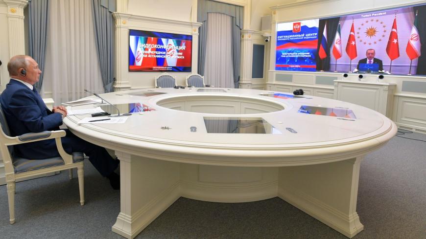 Russian President Vladimir Putin attends by a video conference a trilateral meeting with the leaders of Iran and Turkey on the topic of Syria, in Moscow on July 1, 2020. (Photo by Alexey DRUZHININ / SPUTNIK / AFP) (Photo by ALEXEY DRUZHININ/SPUTNIK/AFP via Getty Images)