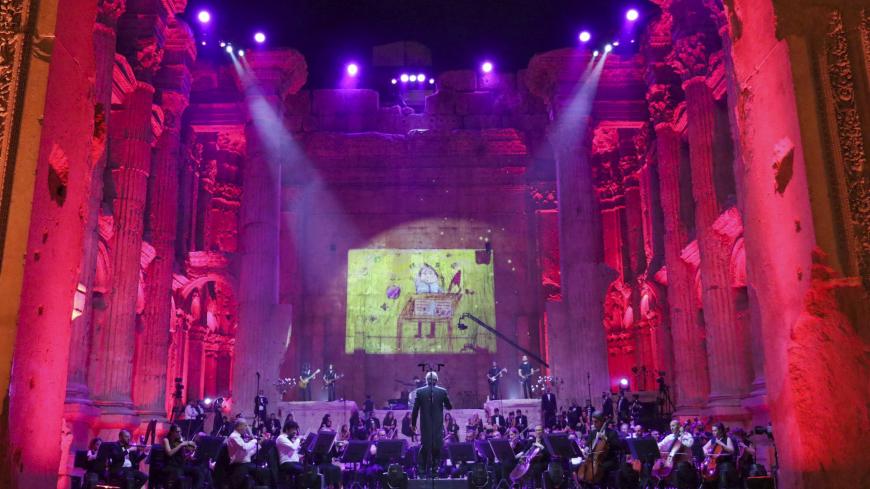 Maestro Harout Fazlian conducts rehearsals ahead of the Sound of Resilience concert inside the Temple of Bacchus at the historic site of Baalbek in Lebanon's eastern Bekaa Valley, on July 4, 2020. - The Lebanese philharmonic orchestra performed to spectator-free Roman ruins in east Lebanon, after a top summer festival downsized to a single concert in a year of economic meltdown and COVID-19 pandemic. The Baalbek International Festival was instead beamed live on television and social media, in what its direc