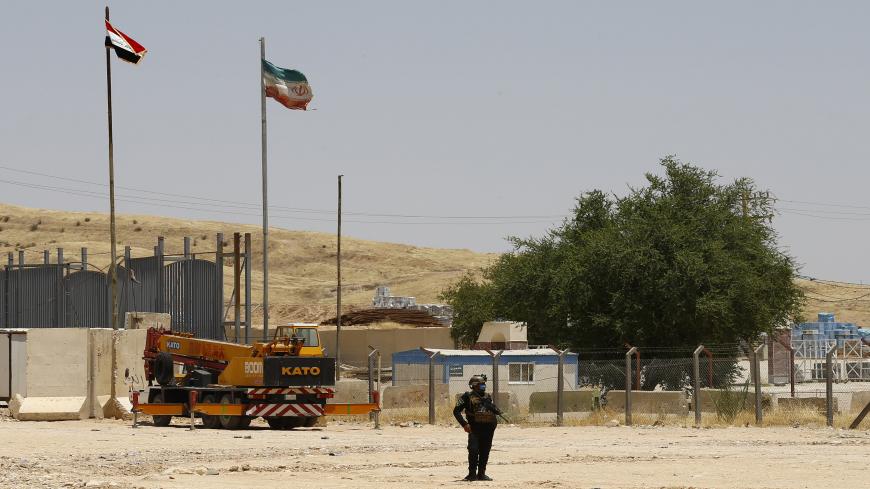 A member of the Iraqi forces stands guard on the Iraqi side of the Mandili crossing on the border with Iran on July 11, 2020. - Iraqi Prime Minister Mustafa al-Kadhemi launched a new campaign against corruption at the country's borders, saying millions of dollars were being lost by not properly taxing imported goods. (Photo by Thaier Al-SUDANI / POOL / AFP) (Photo by THAIER AL-SUDANI/POOL/AFP via Getty Images)