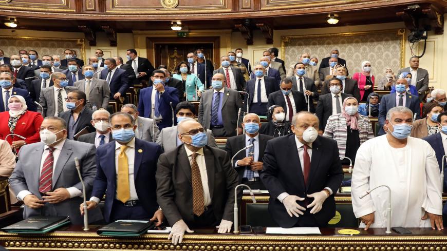 Egyptian parliament members attend a general session in the capital Cairo on July 20, 2020. - Egypt's parliament greenlighted behind a closed-doors session later today, the possible deployment of troops in Libya to support Cairo's ally Khalifa Haftar, if rival Turkish-backed forces recapture the city of Sirte, the house said. (Photo by - / AFP) (Photo by -/AFP via Getty Images)