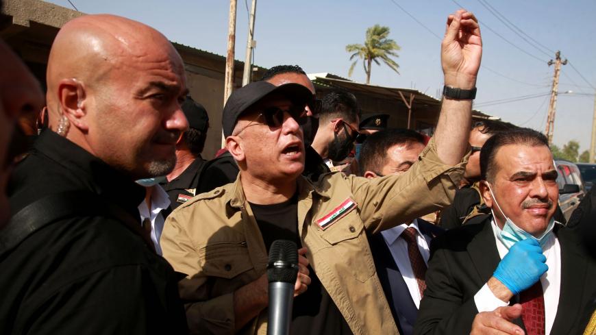 Iraqi Prime Minister Mustafa al-Kadhemi (C) speaks to locals in Tarmiyah, 35 kilometres (20 miles) north of Baghdad on July 20, 2020. (Photo by Khalid MOHAMMED / POOL / AFP) (Photo by KHALID MOHAMMED/POOL/AFP via Getty Images)