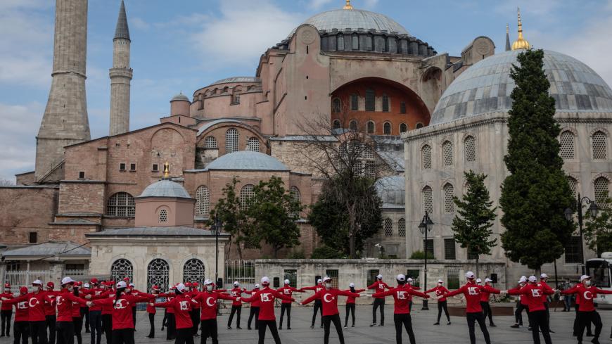 ISTANBUL, TURKEY - JULY 15: People perform in front of the Hagia Sophia Mosque on the fourth anniversary of the July 15, 2016 failed coup attempt on July 15, 2020 in Istanbul, Turkey. On the night of July 15, 2016, 249 people died when military personnel attempted to overthrow the government and President Recep Tayyip Erdogan.  (Photo by Chris McGrath/Getty Images)