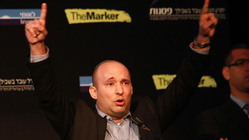Israeli Economy Minister and head of the far-right Jewish Home party, Naftali Bennett gestures as he gives a speech during a debate on economy on March 11, 2015 in the costal Israeli city of Tel Aviv. Six days before Israel votes in a snap general election, the centre-left Zionist Union opened a lead of several points over the ruling rightwing Likud party, a poll showed. Bennett, 42, is a champion of the settler movement and a key challenger of Netanyahu to head Israel's rightwing.    AFP PHOTO / GIL COHEN-