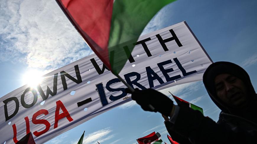 Demonstrators wave Turkish and Palestinian flags during a rally at Yenikap? Square, in Istanbul, to protest against the US-made peace plan, also known as the Agreement of the Century,on Februay 9, 2020. (Photo by Ozan KOSE / AFP) (Photo by OZAN KOSE/AFP via Getty Images)
