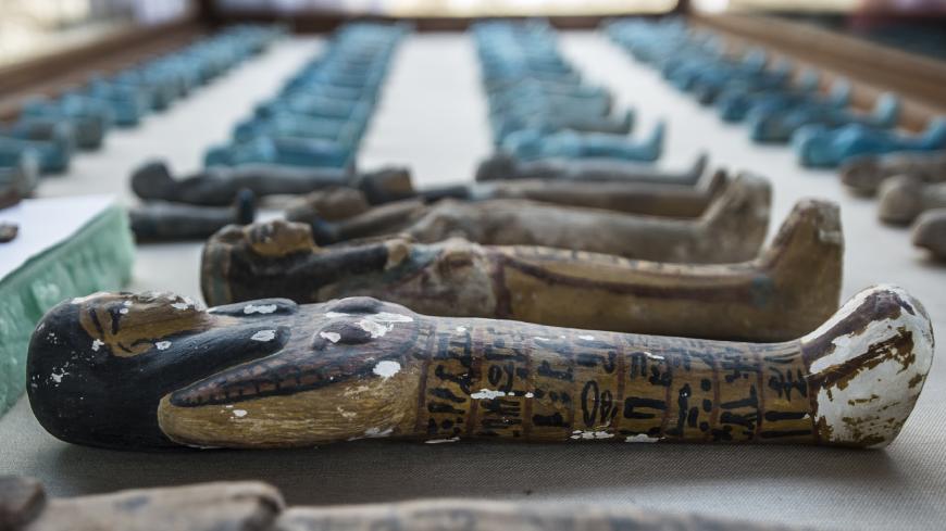 A picture taken on September 9, 2017 shows small funerary statues carved in wood, clay and limestone recovered at the site of a newly-uncovered ancient tomb for a goldsmith dedicated to the ancient Egyptian god Amun, in the Draa Abul Naga necropolis on the west bank of the ancient city of Luxor, which boasts ancient Egyptian temples and burial grounds.
The finds at the tomb of "Amun's Goldsmith, Amenemhat", which dates back to the New Kingdom (16th to 11th centuries BC), also contained a sculpture carved in