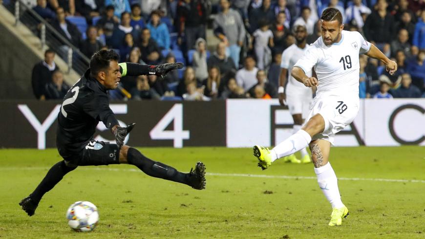 Israel's midfielder Dia Saba (R) shoots the ball past Guatemala's goalkeeper Paulo Motta as he scores during the FIFA friendly football match between Israel and Guatemala at Netanya Municipal Stadium in the Israeli coastal city of Netanya on November 15, 2018. (Photo by JACK GUEZ / AFP)        (Photo credit should read JACK GUEZ/AFP via Getty Images)