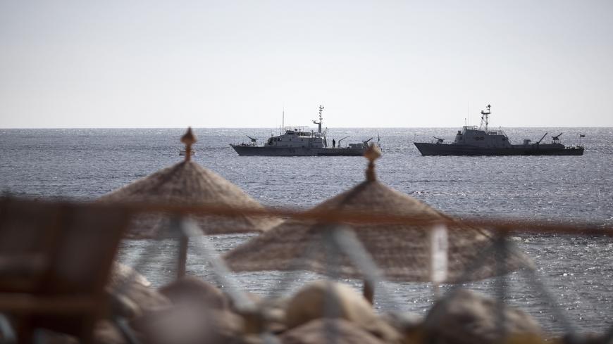 Egyptian navy vessels patrol off the coast of the Red Sea resort city of Sharm el-Sheikh on February 17, 2011. Tourists have started trickling back to Egypt's balmy Red Sea coast in the wake of its national uprising, but ghost-town resorts are still reeling from crises that preceded the unrest. AFP PHOTO/MARCO LONGARI (Photo credit should read MARCO LONGARI/AFP via Getty Images)