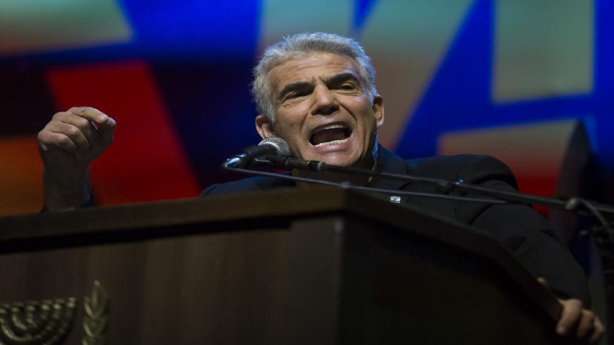TEL AVIV, ISRAEL - MAY 25: Yair Lapid, Blue and White party member speaks at a protest against Netanyahu's 'Immunity Law' on May 25, 2019 in Tel Aviv, Israel. Israeli Prime Minster Benjamin Netanyahu attempt to push for laws that will give him immunity from criminal prosecution as part of the coalition agreements for the next goverment. (Photo by Amir Levy/Getty Images)