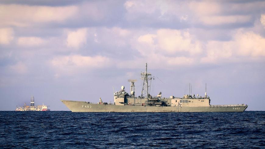 A picture taken on September 25, 2019 in the Mediterranean Sea, off the coast of Cyprus approximately 20 nautical miles (37 kilometers) north-west of Paphos, shows a Turkish army frigate, the TCG Gelibolu, (R) and the drilling vessel Fatih (L), which was deployed by Turkey to search for gas and oil in waters considered part of the EU state's exclusive economic zone (EEZ). (Photo by - / AFP) (Photo credit should read -/AFP via Getty Images)