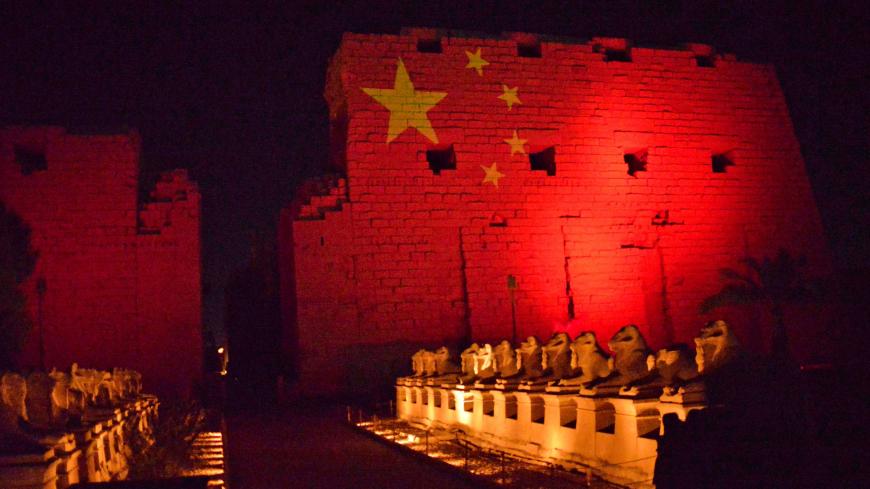 The Karnak Temple in Upper Egypt's ancient city of Luxor is pictured on March 1, 2020 with the Chinese flag in solidarity with the Chinese people amidst a world outbreak of coronavirus COVID-19, which originated in China. (Photo by - / AFP) (Photo by -/AFP via Getty Images)