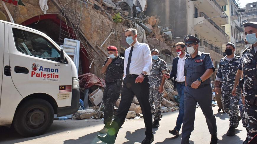 Lebanon's newly-appointed Prime Minister Mustapha Adib (C) visits Beirut's badly-hit Gemmayzeh neighbourhood, on August 31, 2020. - Lebanon's under-fire political leaders designated a new prime minister, the diplomat Mustapha Adib, to tackle the country's deep political and economic crisis, hours before French President Emmanuel Macron was due to visit. (Photo by - / AFP) (Photo by -/AFP via Getty Images)