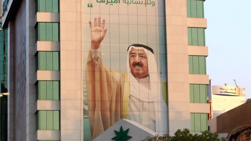 A picture taken on September 29, 2020 in Kuwait City shows a portrait of Kuwait's emir, Sheikh Sabah Al-Ahmad Al-Sabah. - Sheikh Sabah Al-Ahmad Al-Sabah, regarded as the architect of the nation's modern foreign policy, died today at the age of 91, according to the royal court. (Photo by Yasser Al-Zayyat / AFP) (Photo by YASSER AL-ZAYYAT/AFP via Getty Images)