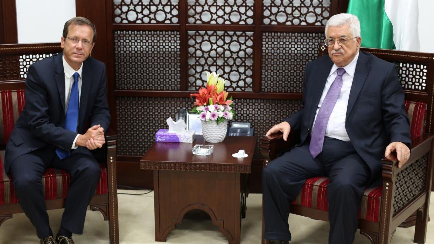 Israeli co-leader of the Zionist Union party and Labour Party's leader Isaac Herzog (L) meets with Palestinian Authority President Mahmud Abbas in the West Bank city of Ramallah on August 18, 2015. AFP PHOTO/ABBAS MOMANI (Photo credit should read ABBAS MOMANI/AFP via Getty Images)