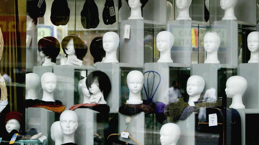 BNEI BRAK, ISRAEL ? MAY 14:  After real human hair wigs were removed from the display, shop window dummies are bareheaded in a wig shop, on May 14, 2004 in the ultra-Orthodox Jewish town of Bnei Brak near Tel Aviv in central Israel. Several Israeli rabbis issued a ban this week on wigs made in India from human hair, saying said the hair may have been used in Hindu religious ceremonies, which are considered idolatrous by Orthodox Judaism.  (Photo by Uriel Sinai/Getty Images)