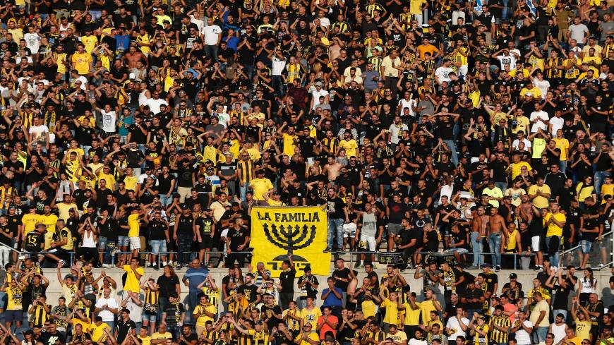 Beitar Jerusalem fans cheer on their team prior to the UEFA Europa League play-off football match between Beitar Jerusalem and AS Saint-Etienne, at the Itztadion Teddy Stadium in Jerusalem on August 17, 2016. 
Saint-Etienne beat Beitar Jerusalem 2-1. / AFP / AHMAD GHARABLI        (Photo credit should read AHMAD GHARABLI/AFP via Getty Images)
