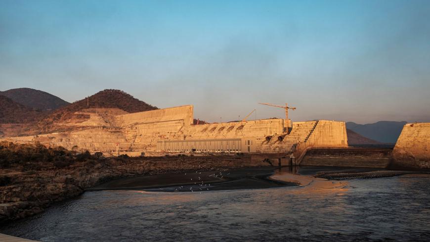 A general view of the the Grand Ethiopian Renaissance Dam (GERD), near Guba in Ethiopia, on December 26, 2019. - The Grand Ethiopian Renaissance Dam, a 145-metre-high, 1.8-kilometre-long concrete colossus is set to become the largest hydropower plant in Africa.
Across Ethiopia, poor farmers and rich businessmen alike eagerly await the more than 6,000 megawatts of electricity officials say it will ultimately provide. 
Yet as thousands of workers toil day and night to finish the project, Ethiopian negotiators