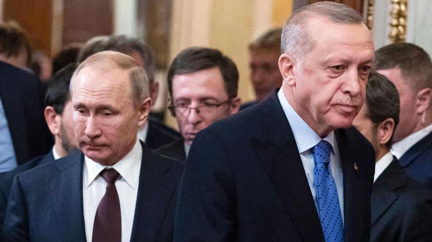 Russian President Vladimir Putin and his Turkish counterpart Recep Tayyip Erdogan arrive to hold a joint press statement following their talks at the Kremlin in Moscow on March 5, 2020. (Photo by Pavel Golovkin / POOL / AFP) (Photo by PAVEL GOLOVKIN/POOL/AFP via Getty Images)