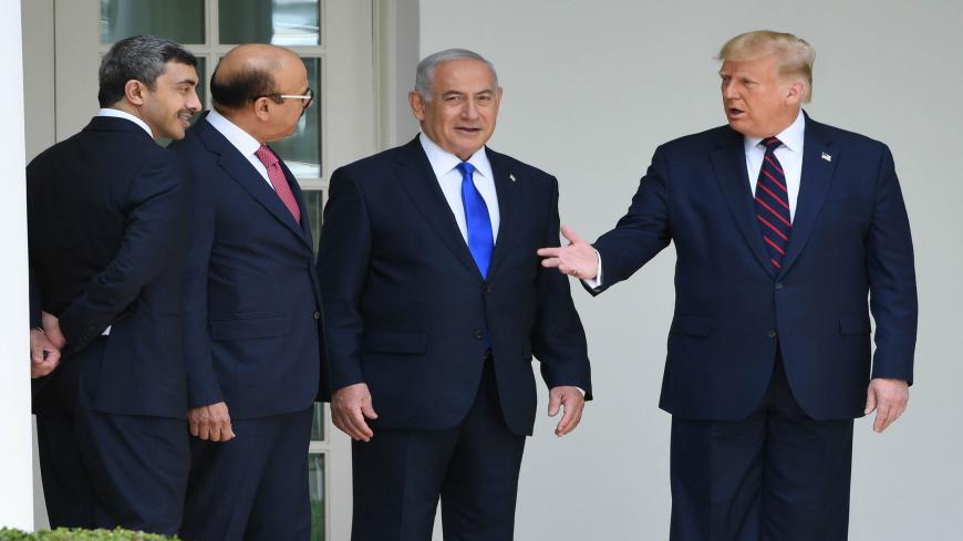 US President Donald Trump (R) with UAE Foreign Minister Abdullah bin Zayed Al-Nahyan (L), Bahrain Foreign Minister Abdullatif al-Zayani (2-L) and Israeli Prime Minister Benjamin Netanyahu (C) pose for pictures in the colonnade at the White House before the signing of the Abraham Accords where the countries of Bahrain and the United Arab Emirates recognize Israel, in Washington, DC, September 15, 2020. - Israeli Prime Minister Benjamin Netanyahu and the foreign ministers of Bahrain and the United Arab Emirat