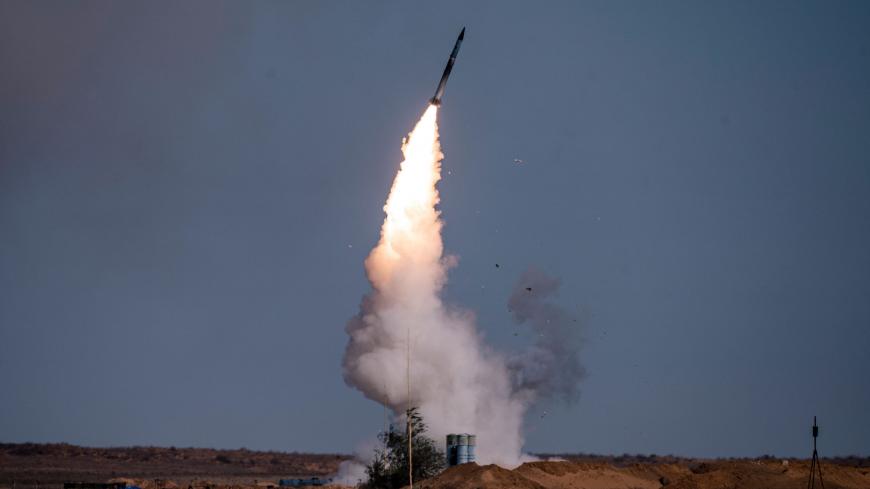 A rocket launches from a S-400 missile system at the Ashuluk military base in Southern Russia on September 22, 2020 during the "Caucasus-2020" military drills gathering China, Iran, Pakistan and Myanmar troops, along with ex-Soviet Armenia, Azerbaijan and Belarus. - Up to 250 tanks and around 450 infantry combat vehicles and armoured personnel carriers will take part in the September 21 to 26 land and naval exercises that will involve 80,000 people including support staff. (Photo by Dimitar DILKOFF / AFP) (