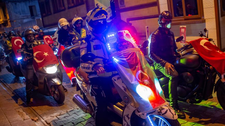 People display Turkish and Azerbaijan flags on their scooters as they take a tour in the city in solidarity with Azerbaijan called by Turkey's Humanitarian Relief Foundation (IHH), in Istanbul on October 5, 2020. - Turkey on October 4, 2020 condemned what it said were attacks on civilians by Armenian forces on the Azerbaijani city of Ganja in the conflict over disputed breakaway region Nagorno-Karabakh. The fighting over Karabakh, which broke out into renewed fighting seven days ago, intensified as Armenian