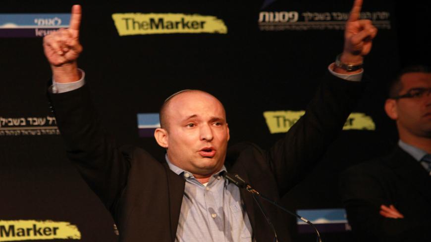 Israeli Economy Minister and head of the far-right Jewish Home party, Naftali Bennett gestures as he gives a speech during a debate on economy on March 11, 2015 in the costal Israeli city of Tel Aviv. Six days before Israel votes in a snap general election, the centre-left Zionist Union opened a lead of several points over the ruling rightwing Likud party, a poll showed. Bennett, 42, is a champion of the settler movement and a key challenger of Netanyahu to head Israel's rightwing. AFP PHOTO / GIL COHEN-