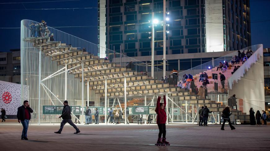 People stand on the "Meeting Point", a temporary designed mobile public forum and exhibition center on Febuary 18, 2020 near Gezi Park in Istanbul. (Photo by Yasin AKGUL / AFP) (Photo by YASIN AKGUL/AFP via Getty Images)