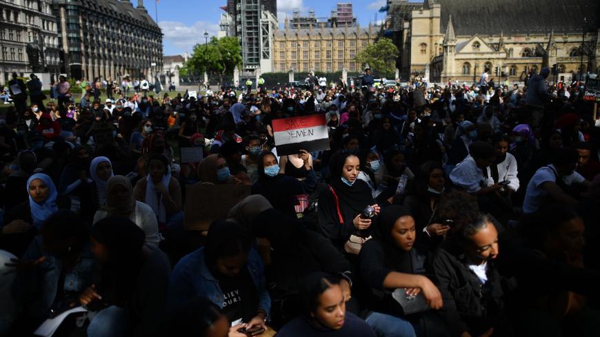 Protesters with Yemeni flags protest in Parliament Square in London on July 5, 2020, against the continued conflict in Yemen at the same time that supporters of the Black Lives Matter movement listen to speeches in a further action in the aftermath of the death of unarmed black man George Floyd in police custody in the US. - Yemen has been locked in conflict since the Huthis took control of Sanaa in 2014 and went on to seize much of the north. The crisis escalated when the Saudi-led coalition intervened the