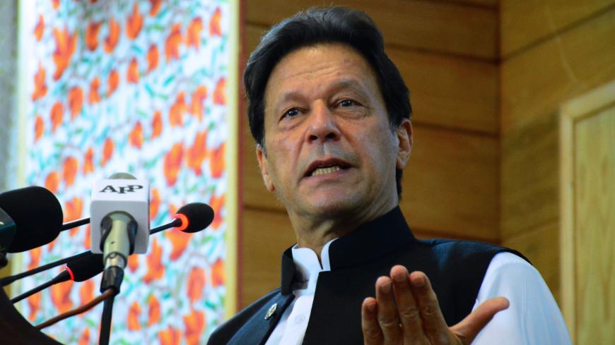 Pakistan's Prime Minister Imran Khan addresses the legislative assembly in Muzaffarabad, the capital of Pakistan-controlled Kashmir on August 5, 2020, to mark the one-year anniversary after New Delhi imposed direct rule on Indian-administered Kashmir. - Pakistani Prime Minister Imran Khan on August 5 branded India an "oppressor and aggressor" a year after New Delhi imposed direct rule on Indian-administered Kashmir. (Photo by - / AFP) (Photo by -/AFP via Getty Images)